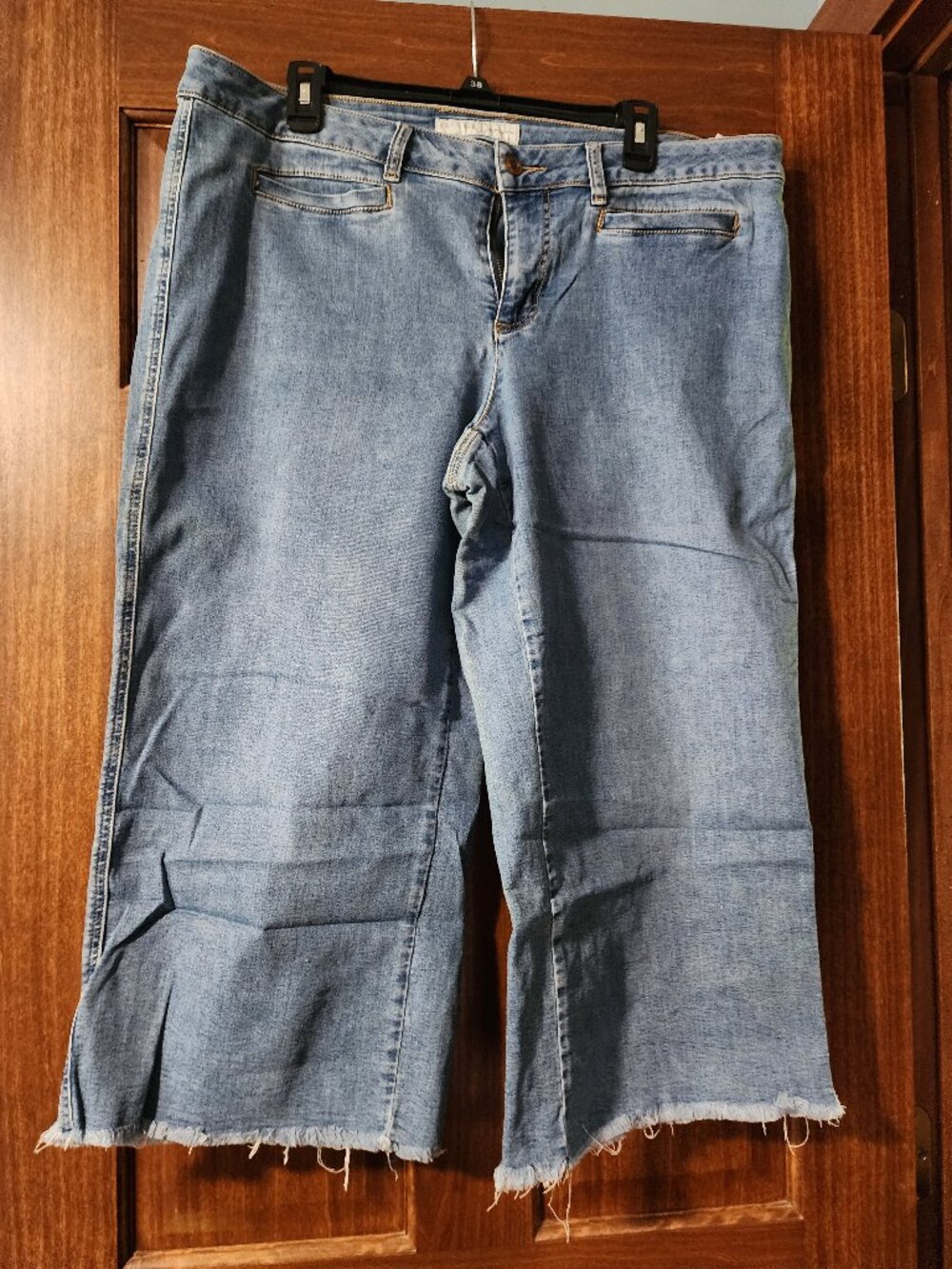 Cato mid-to-high rise cropped wide-leg jeans with a prominent raw frayed